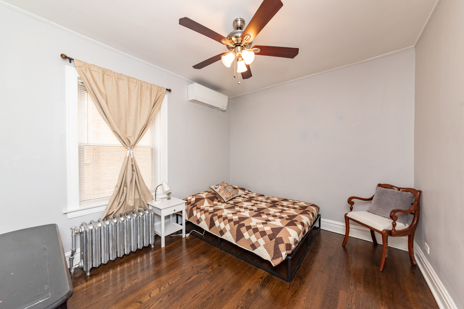 4014 West Nelson Street, Unit 1 Chicago, IL 60641 - Photo 15 of 21 a bedroom with a bed window and a chair