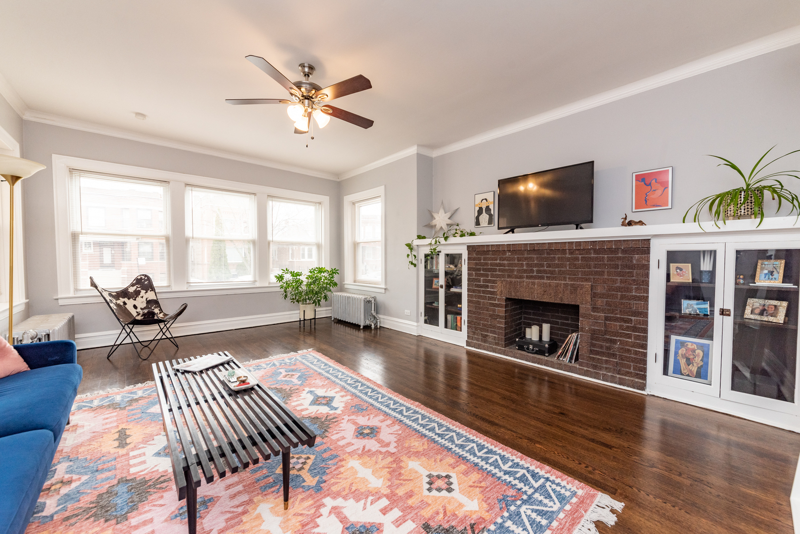 4014 West Nelson Street, Unit 1 Chicago, IL 60641 - Photo 2 of 21 a living room with furniture and a fireplace