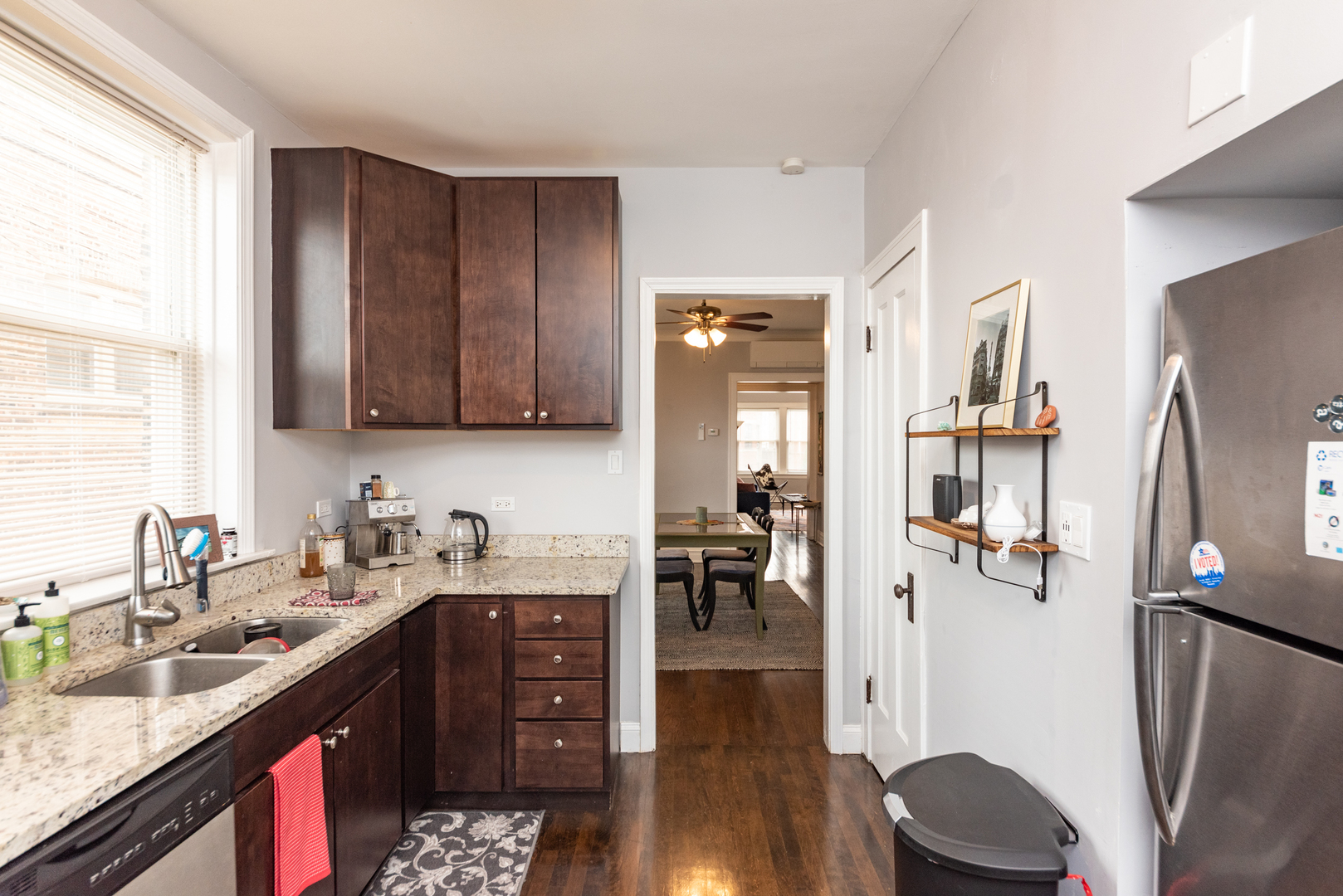 4014 West Nelson Street, Unit 1 Chicago, IL 60641 - Photo 9 of 21 a kitchen with stainless steel appliances granite countertop a refrigerator stove and sink