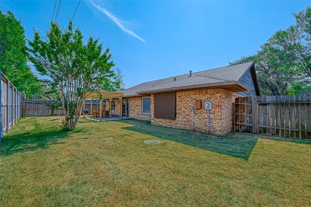 a view of a backyard with a small cabin