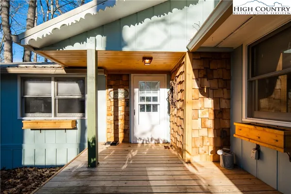 a view of a brick house with a large windows