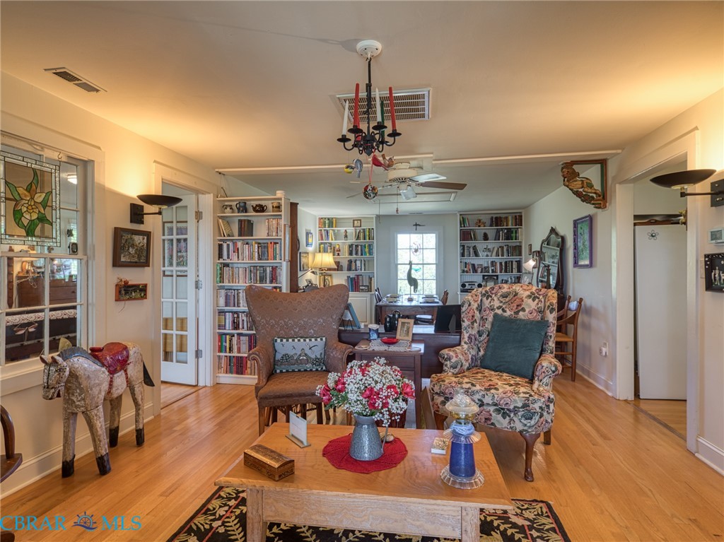 9078 Stump Point Road Hayes, VA 23072 - Photo 14 of 28 Sitting room with a ceiling fan and light wood-style flooring
