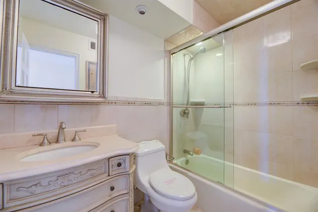 a bedroom with a bed and cupboard