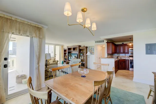 a kitchen with granite countertop cabinets stainless steel appliances and wooden cabinets