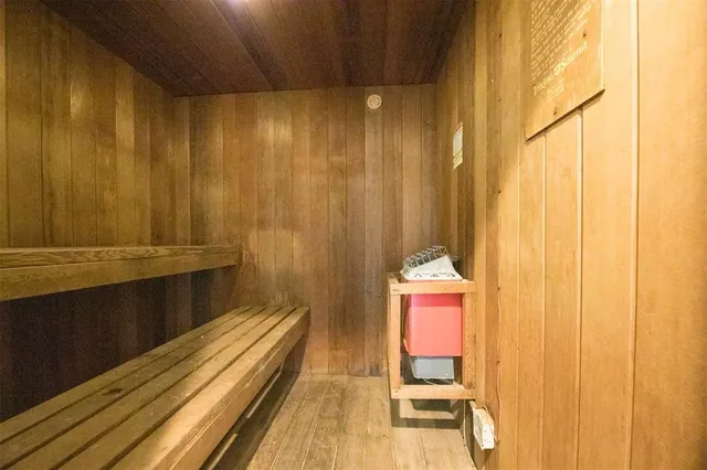 a room with gym equipment and large window