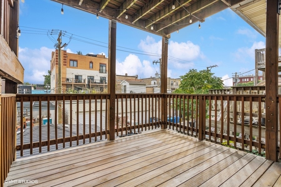 1219 West Melrose Street, Unit 2 Chicago, IL 60657 - Photo 13 of 13 a view of a balcony with wooden floor