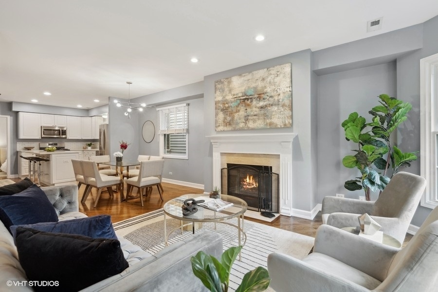 1219 West Melrose Street, Unit 2 Chicago, IL 60657 - Photo 4 of 13 a living room with furniture fireplace and potted plant