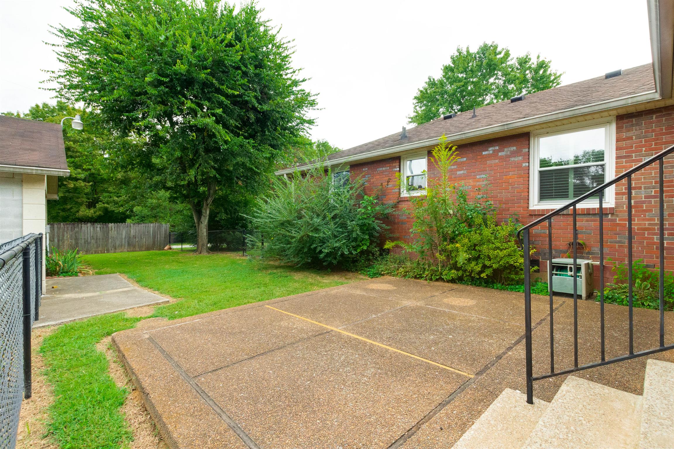 706 East Campbell Road Madison, TN 37115 - Photo 19 of 25 Fenced courtyard area is great for a pet.