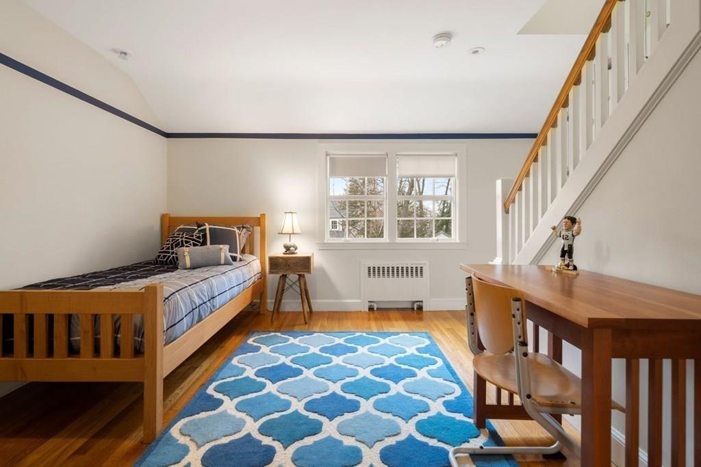 2 Lexington Avenue Lexington, MA 02421 - Photo 22 of 39 a bedroom with furniture and a bathtub