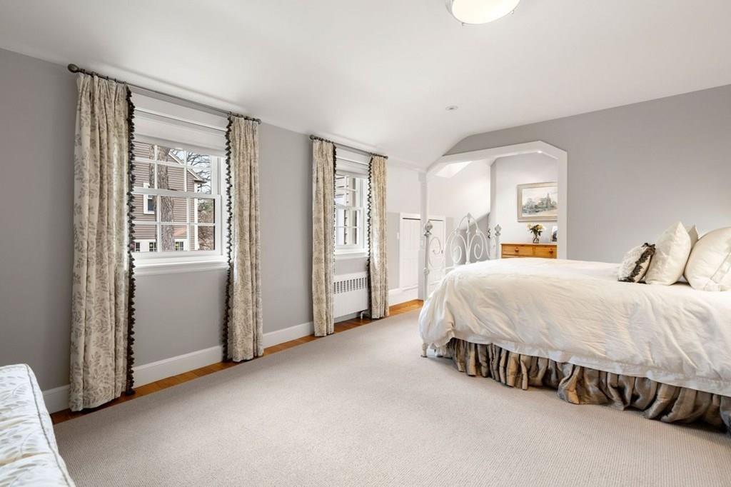 2 Lexington Avenue Lexington, MA 02421 - Photo 27 of 39 a spacious bedroom with a bed and window
