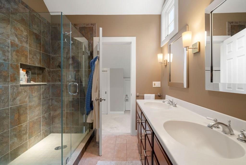 2 Lexington Avenue Lexington, MA 02421 - Photo 31 of 39 a bathroom with a double vanity sink and mirror