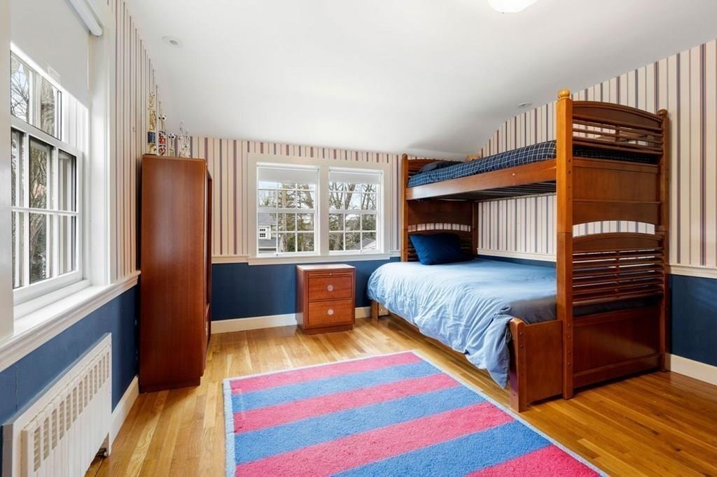 2 Lexington Avenue Lexington, MA 02421 - Photo 32 of 39 a bedroom with a bed and a window