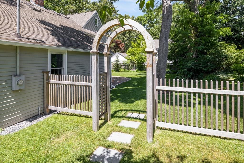 2 Lexington Avenue Lexington, MA 02421 - Photo 37 of 39 a view of a wooden house with a small yard