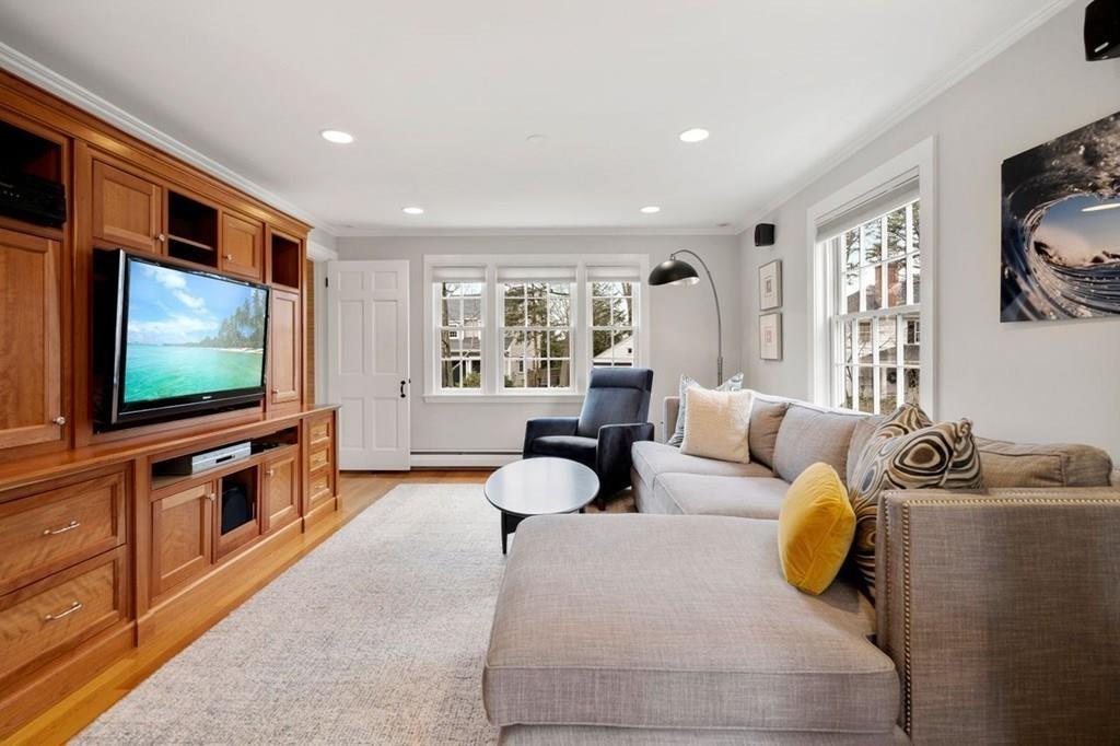 2 Lexington Avenue Lexington, MA 02421 - Photo 6 of 39 a living room with furniture and a flat screen tv