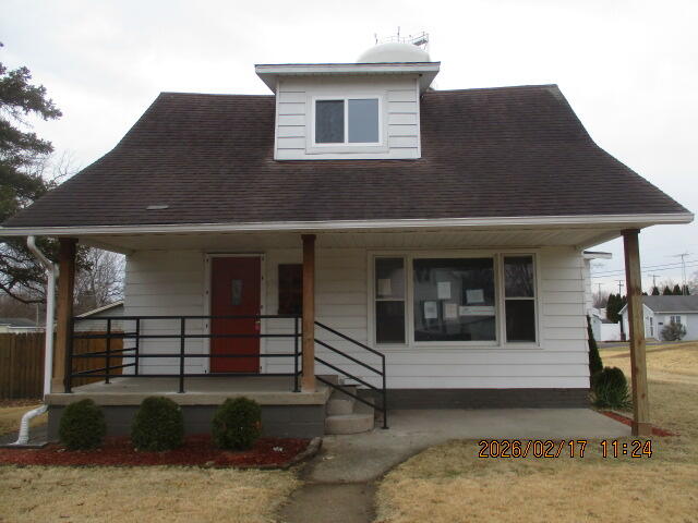 407 East State Street Morocco, IN 47963 - Photo 1 of 18 a front view of a house with stairs