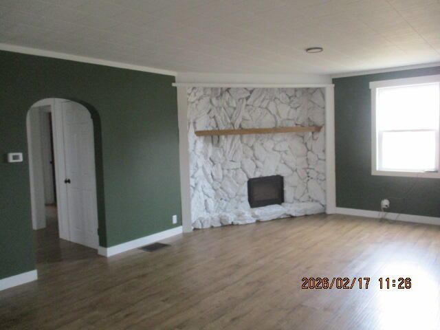 407 East State Street Morocco, IN 47963 - Photo 5 of 18 an empty room with windows and fireplace