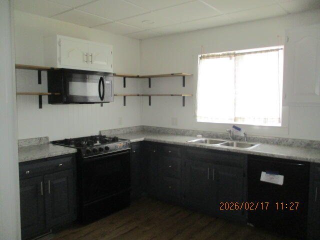 407 East State Street Morocco, IN 47963 - Photo 6 of 18 a kitchen with a sink and a stove