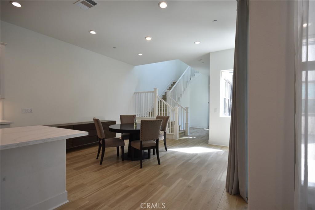 364 Baluster Irvine, CA 92618 - Photo 15 of 56 a view of a dining room with furniture window and wooden floor