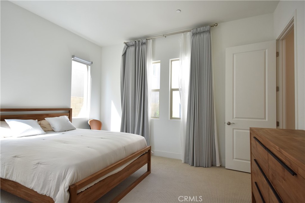364 Baluster Irvine, CA 92618 - Photo 21 of 56 a bedroom with a bed and a window