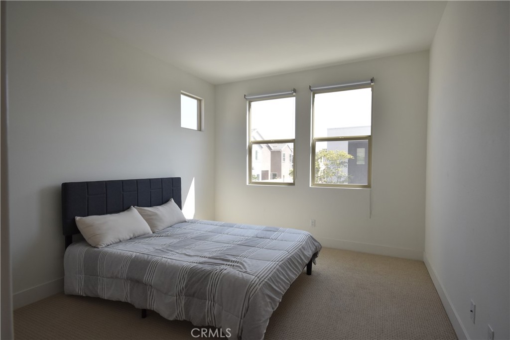 364 Baluster Irvine, CA 92618 - Photo 26 of 56 a bed sitting in a bedroom next to a window