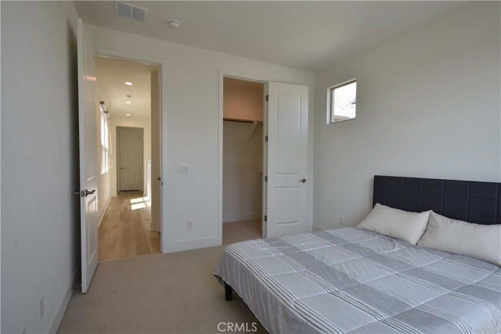 364 Baluster Irvine, CA 92618 - Photo 27 of 56 a bedroom with a bed and closet