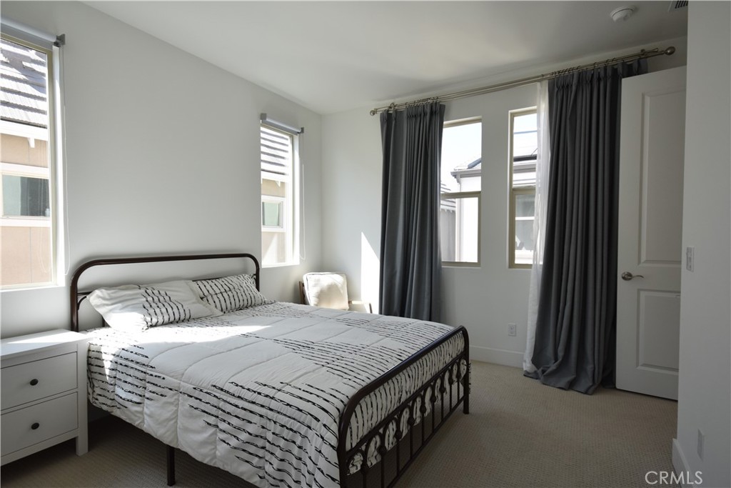 364 Baluster Irvine, CA 92618 - Photo 34 of 56 a bedroom with bed and window