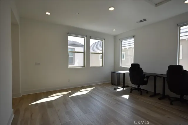 a bedroom with a bed and a night stand