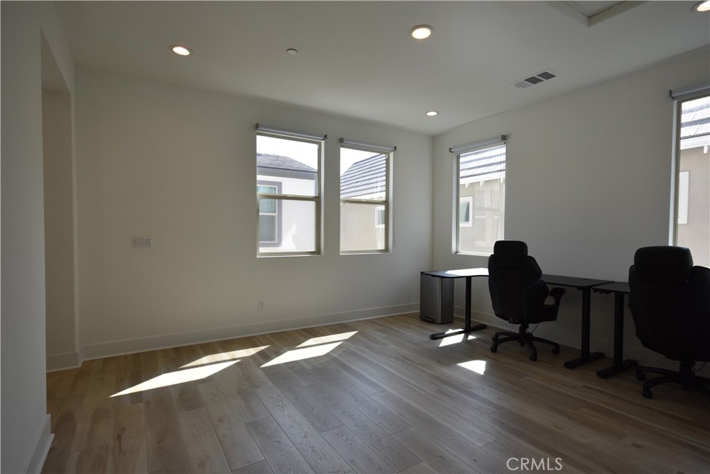 364 Baluster Irvine, CA 92618 - Photo 38 of 56 a workspace with wooden floor and a window