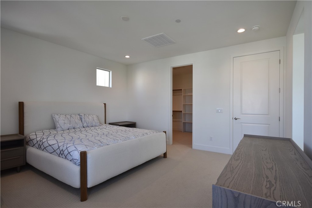 364 Baluster Irvine, CA 92618 - Photo 41 of 56 a bedroom with a bed and a night stand