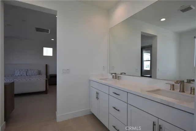 a bedroom with bed and window