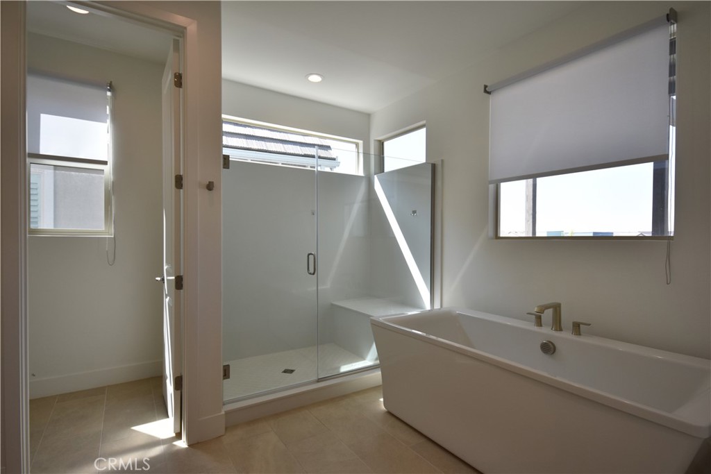364 Baluster Irvine, CA 92618 - Photo 51 of 56 a bathroom with a tub and a shower