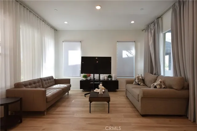 a kitchen with stainless steel appliances granite countertop a stove a refrigerator and a stove top oven