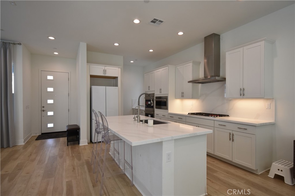 364 Baluster Irvine, CA 92618 - Photo 10 of 56 a kitchen with a sink stove and cabinets