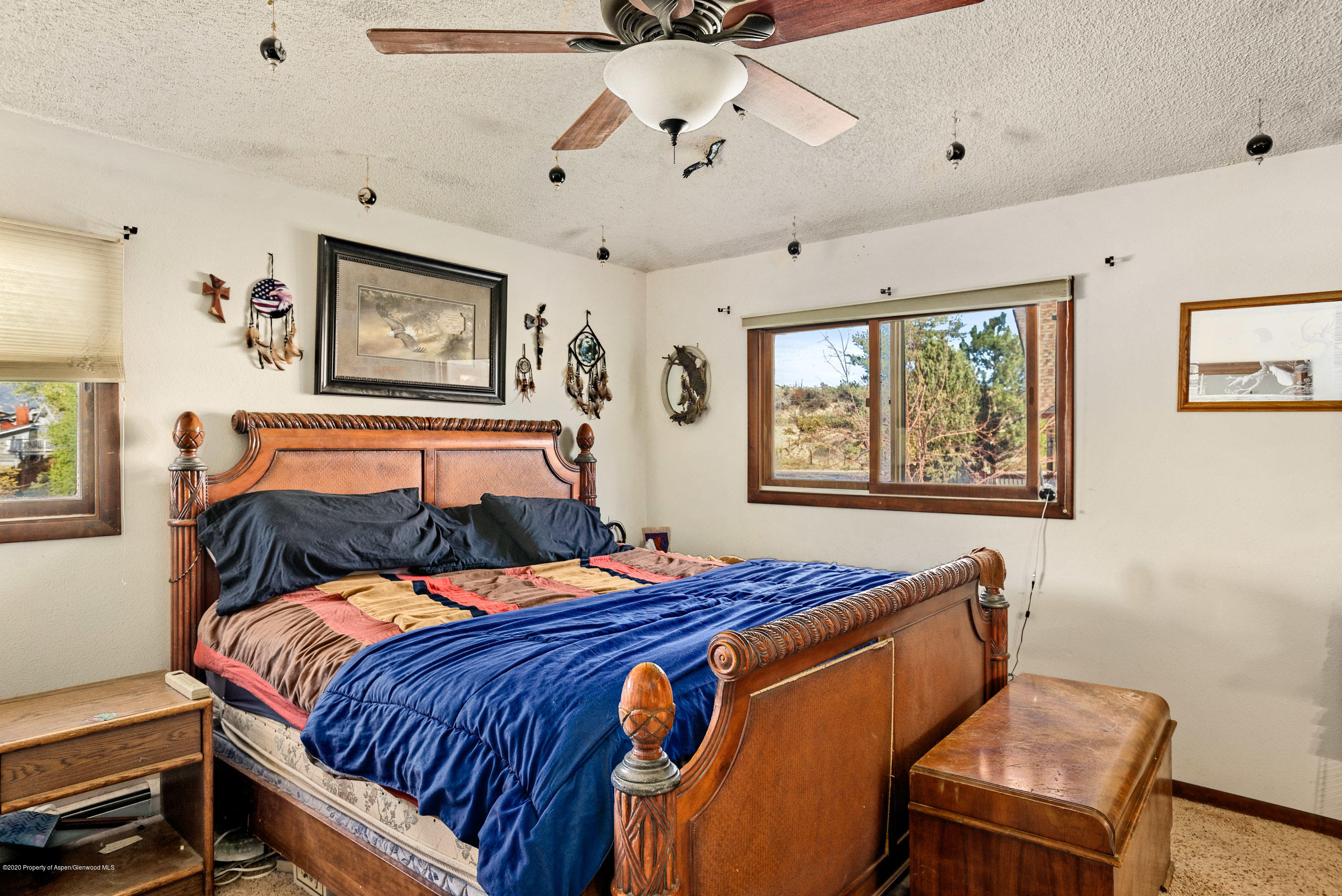 690 Moki Avenue Rifle, CO 81650 - Photo 7 of 15 a bedroom with bed and wooden floor