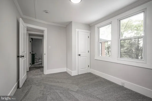 a view of an empty room with a window