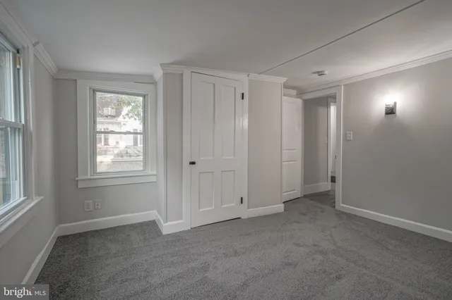a bathroom with a shower a toilet and sink