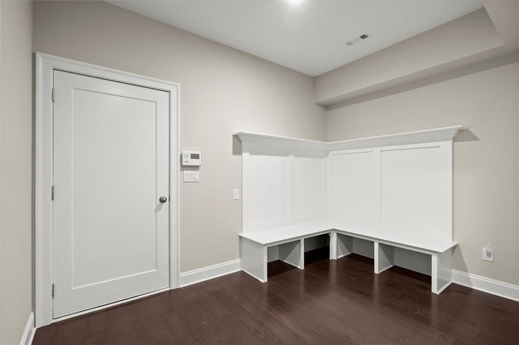 293 Thompson Street Alpharetta, GA 30009 - Photo 45 of 71 a view of an empty room with wooden floor