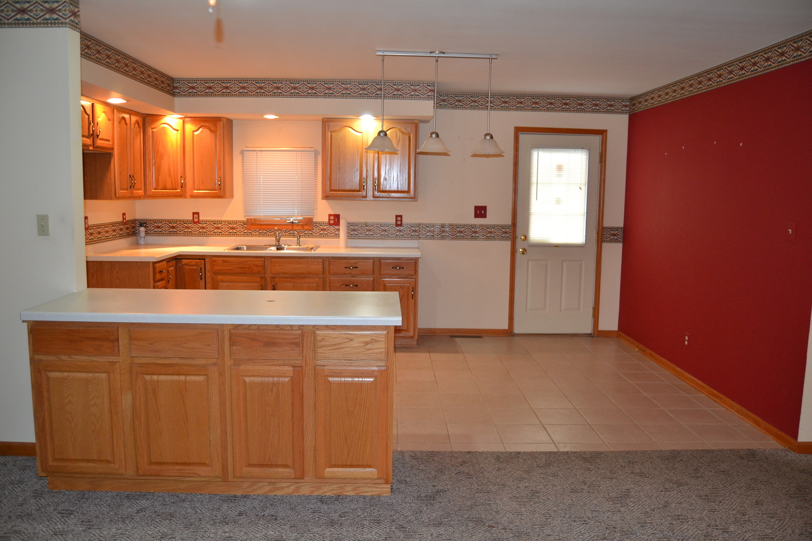 208 Nebraska Street, Unit A Ottawa, IL 61350 - Photo 3 of 14 a view of a kitchen with a sink and cabinets