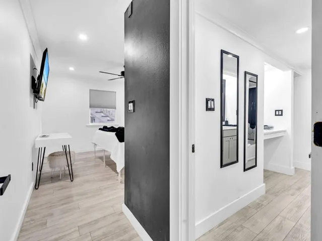 wooden floor in a livingroom with a dining table and chairs