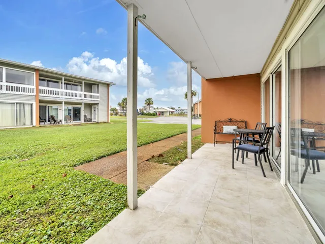 a house view with a sitting space and balcony