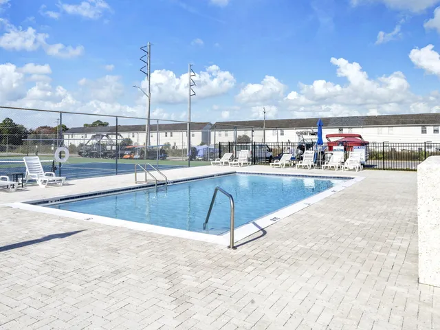 a view of a living room and kitchen
