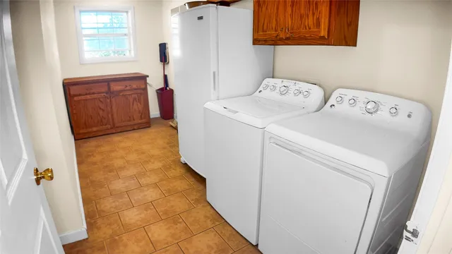 a utility room with dryer and washer