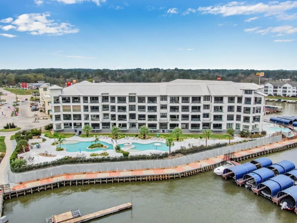 199 Waterpoint Court, Unit 302 Conroe, TX 77356 - Photo 20 of 20 Conveniently located near a top tier marina, you’ll have access to full service boat slips, waterside dining, and all the essentials for a luxury lake lifestyle with just a short stroll.