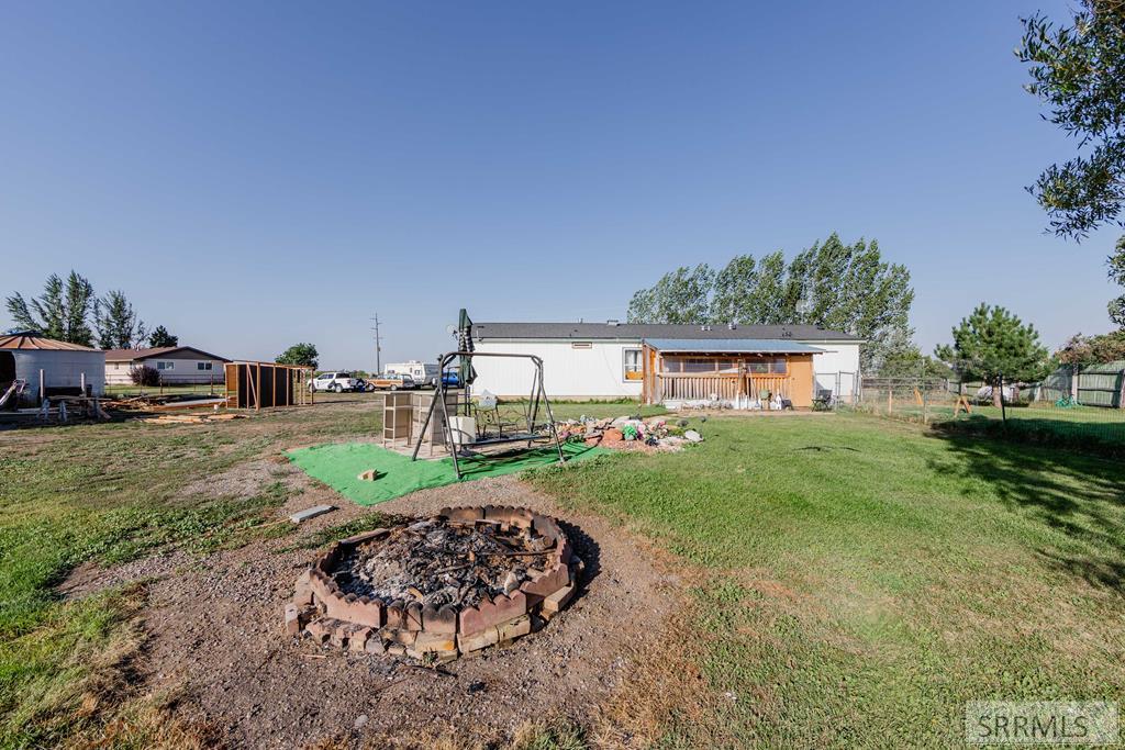 286 North 2300 East St. Anthony, ID 83445 - Photo 22 of 32 Backyard with firepit