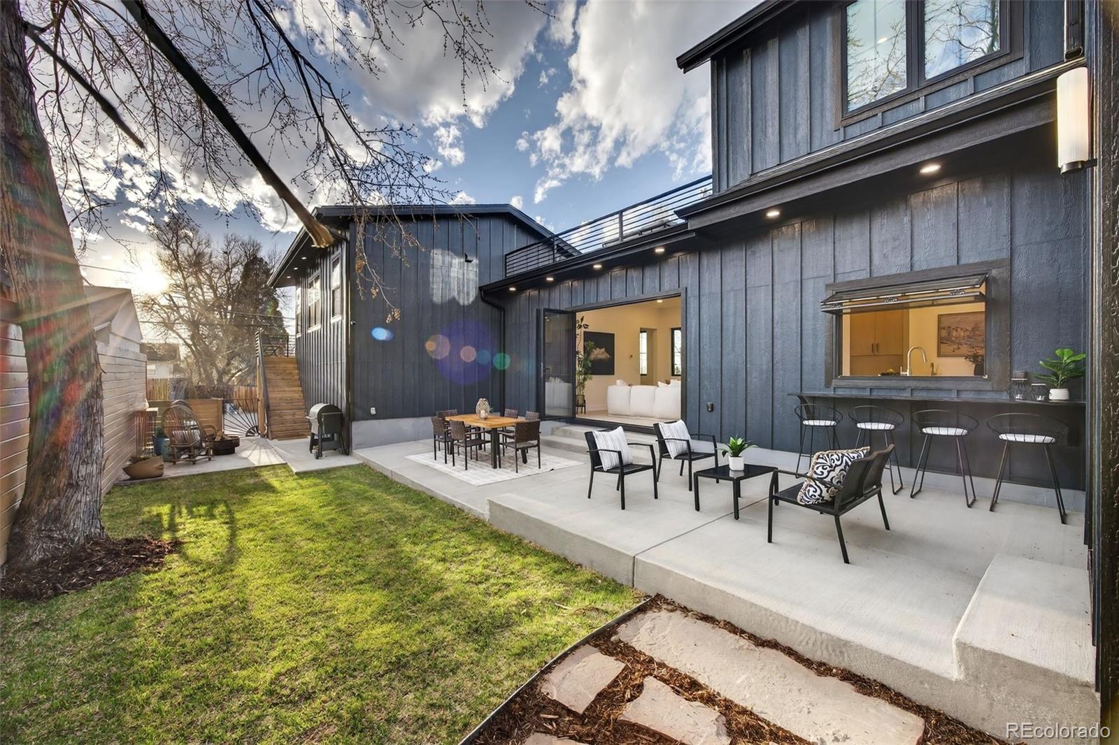 5175 Raleigh Street Denver, CO 80212 - Photo 39 of 49 a view of a swimming pool with outdoor seating