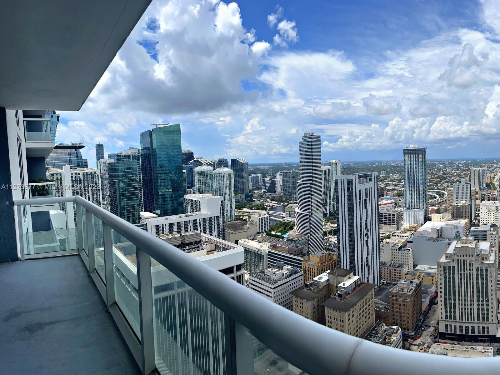 a view of a balcony with city view