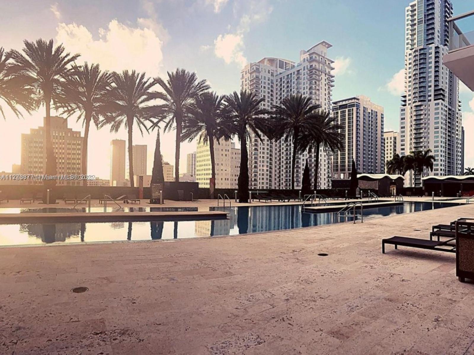 50 Biscayne Boulevard, Unit 5005 Miami, FL 33132 - Photo 17 of 20 a view of swimming pool with outdoor seating and city view