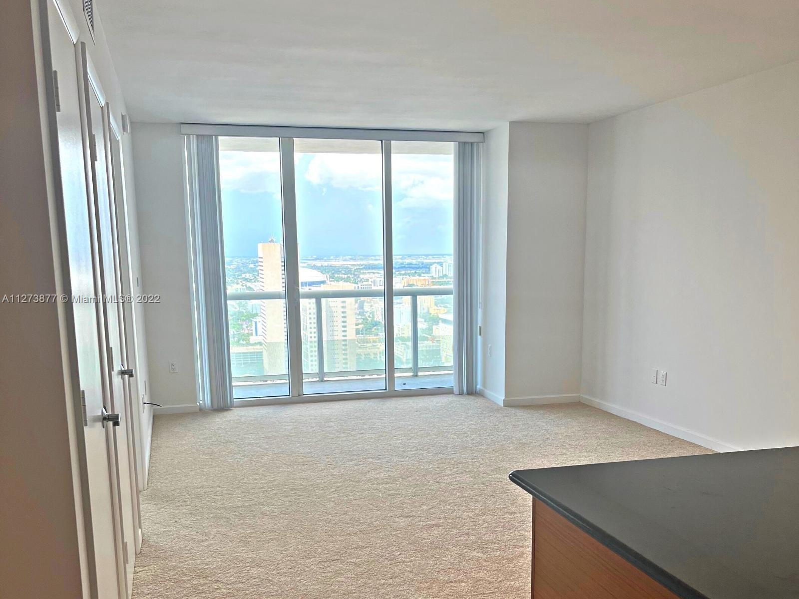 50 Biscayne Boulevard, Unit 5005 Miami, FL 33132 - Photo 2 of 20 a view of an empty room with a window