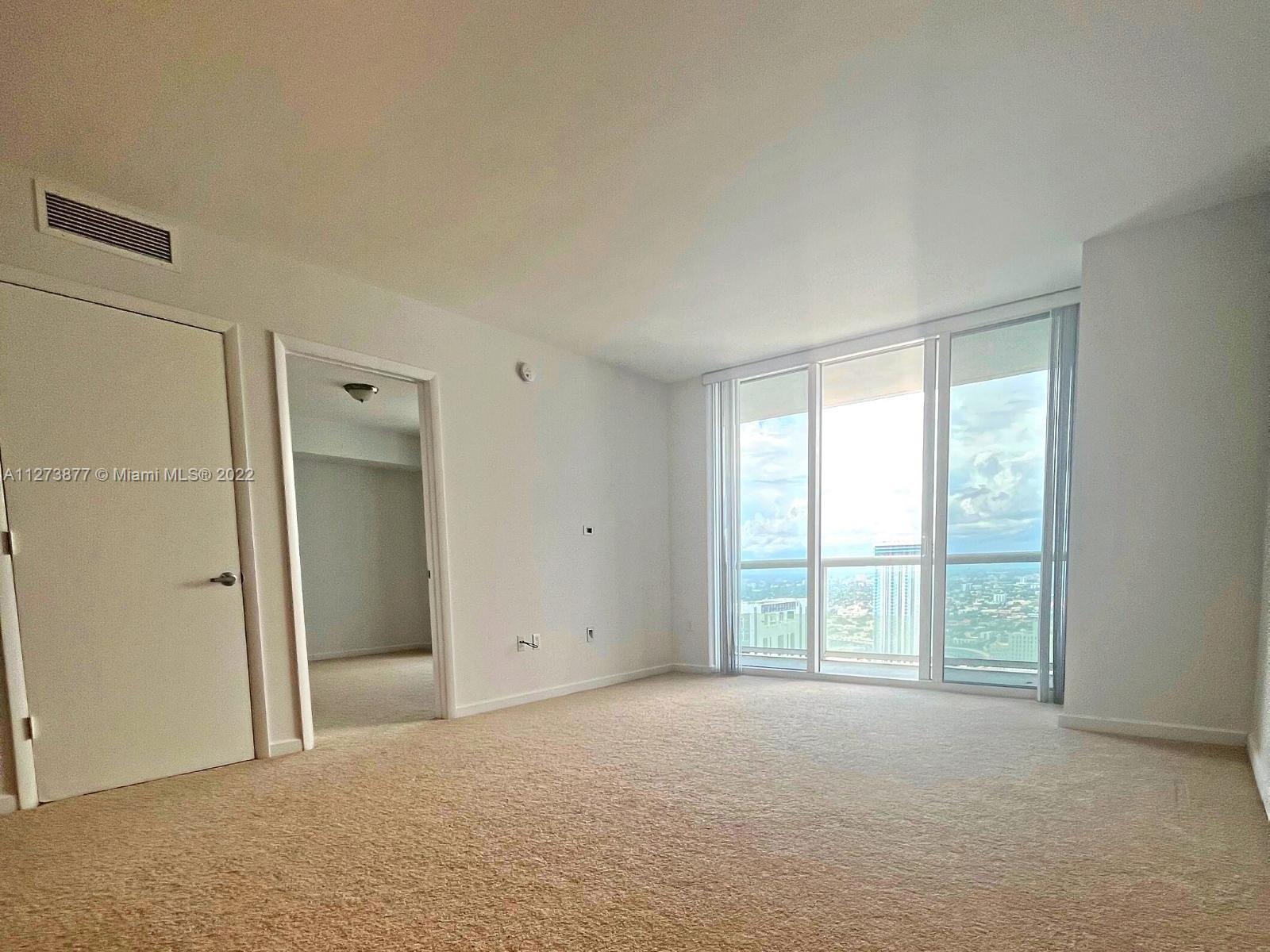 50 Biscayne Boulevard, Unit 5005 Miami, FL 33132 - Photo 3 of 20 a view of an empty room with a window
