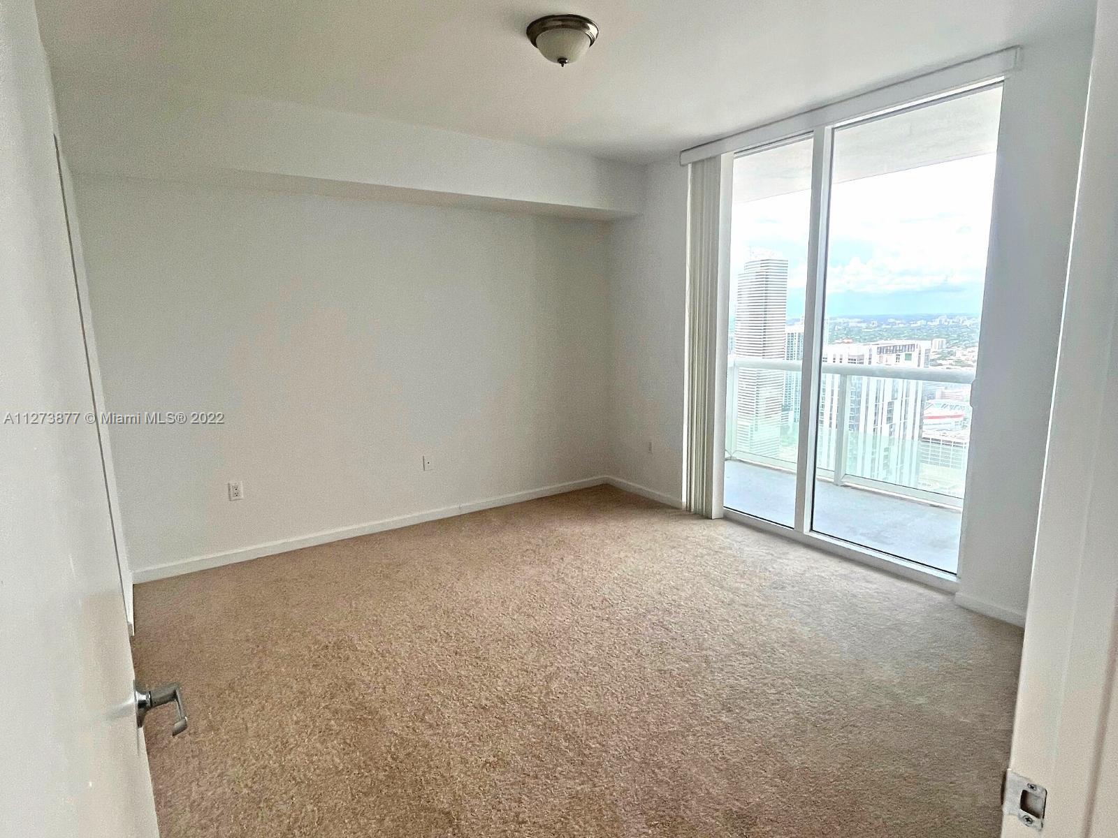 50 Biscayne Boulevard, Unit 5005 Miami, FL 33132 - Photo 8 of 20 a view of an empty room with a window